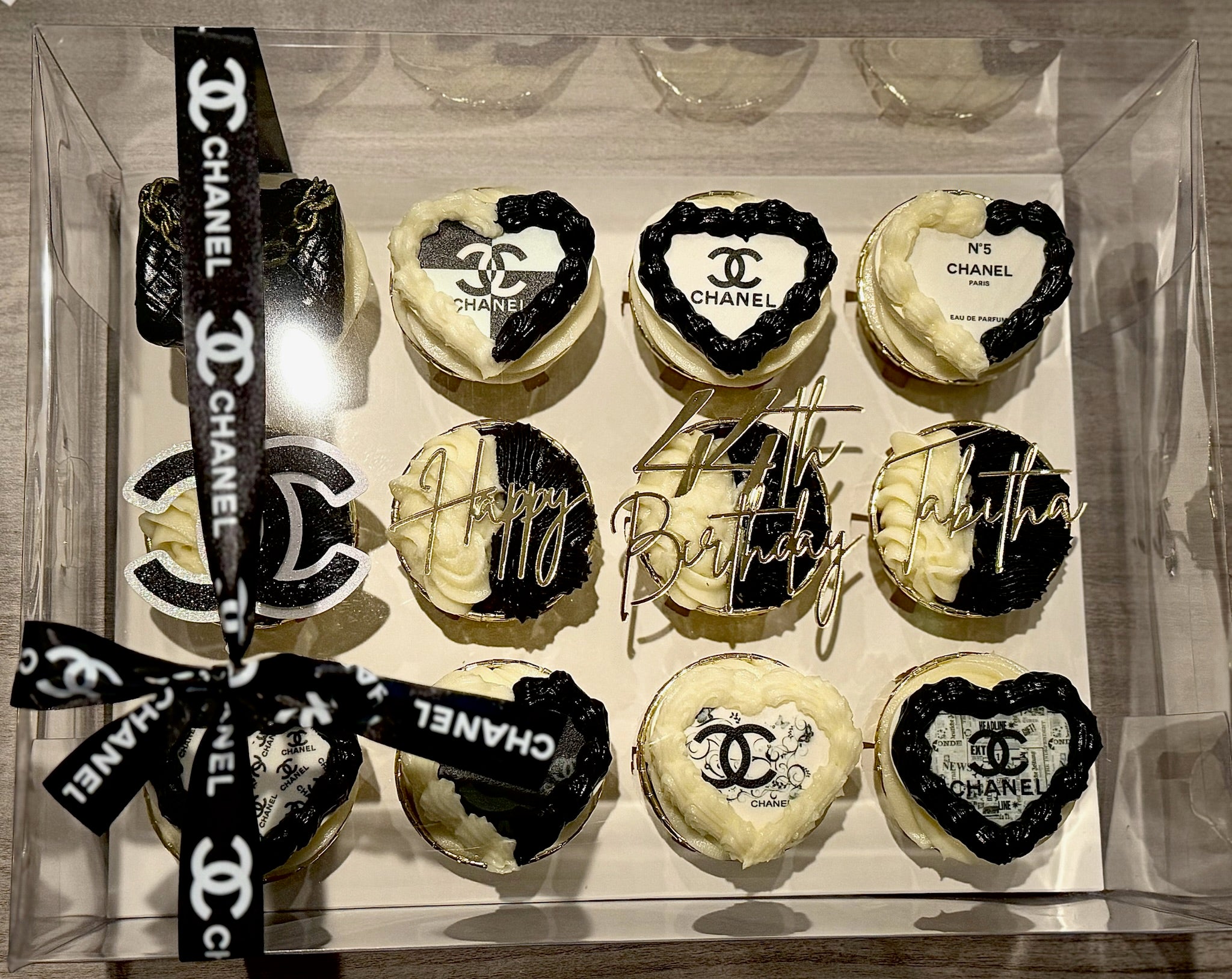 Cupcakes with Chanel logo in a clear box
